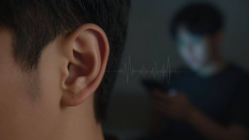 Person listening to phone call audio waves.
AI call analytics sentiment